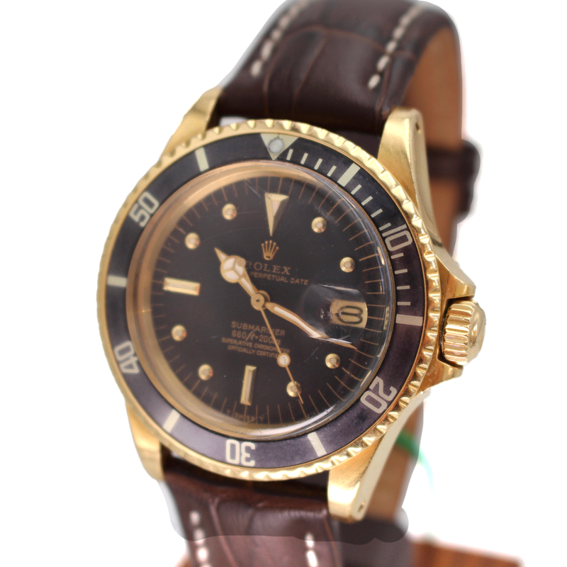 Rolex 1680 yellow gold submariner on a leather strap