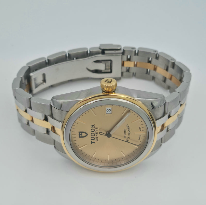Tudor Glamour Gate 55003 with a two tone design of gold and steel on the bracelet and case, the dial is gold with no numerals. Sold in Swiss Watch Club store.